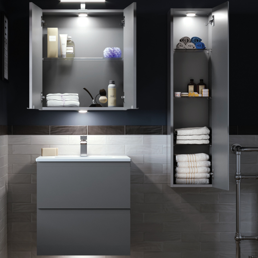 Bathroom with grey cabinets, open shelves showing towels and toiletries, soft lighting for organized feel.